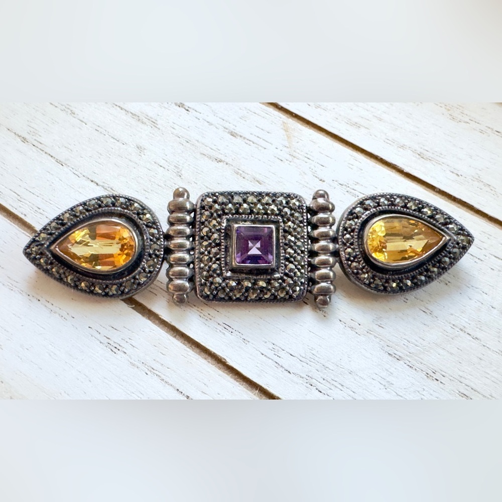Elegant Silver Bracelet with Purple and Yellow Accents